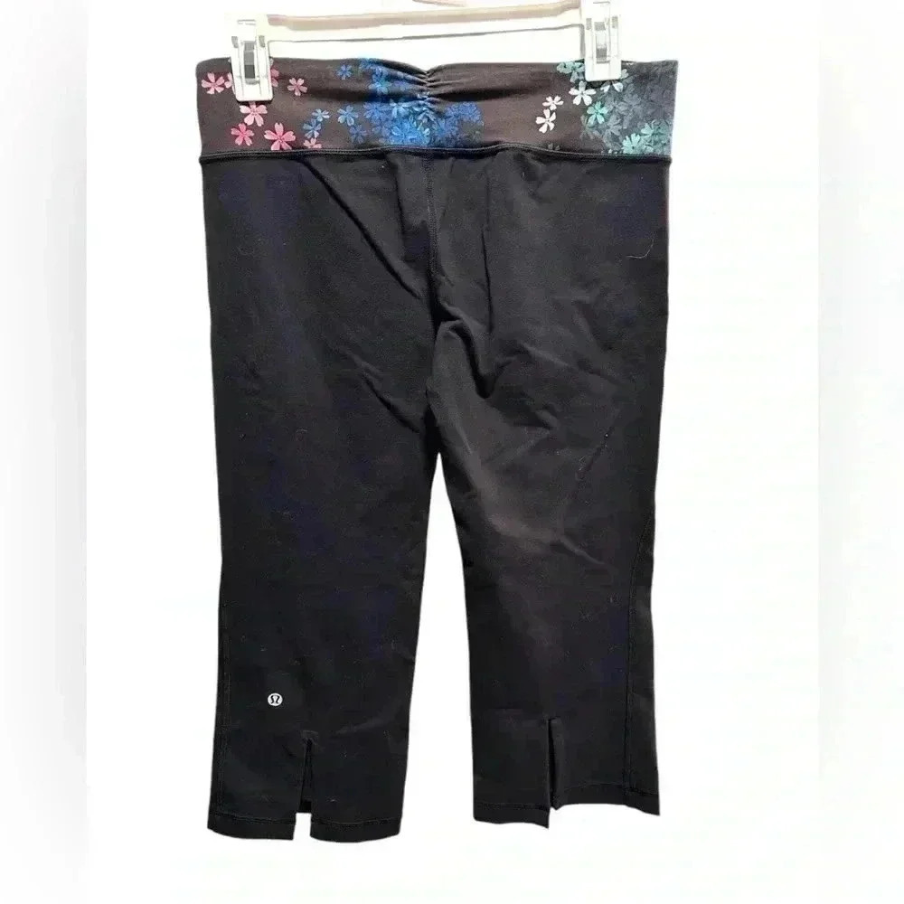 LULULEMON BLACK FLORAL FLARE CROPPED CAPRI LEGGINGS